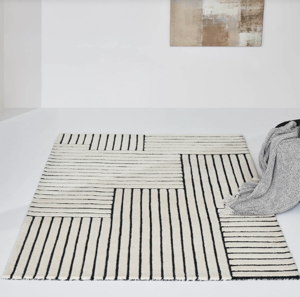 Artica rug on display in a white room