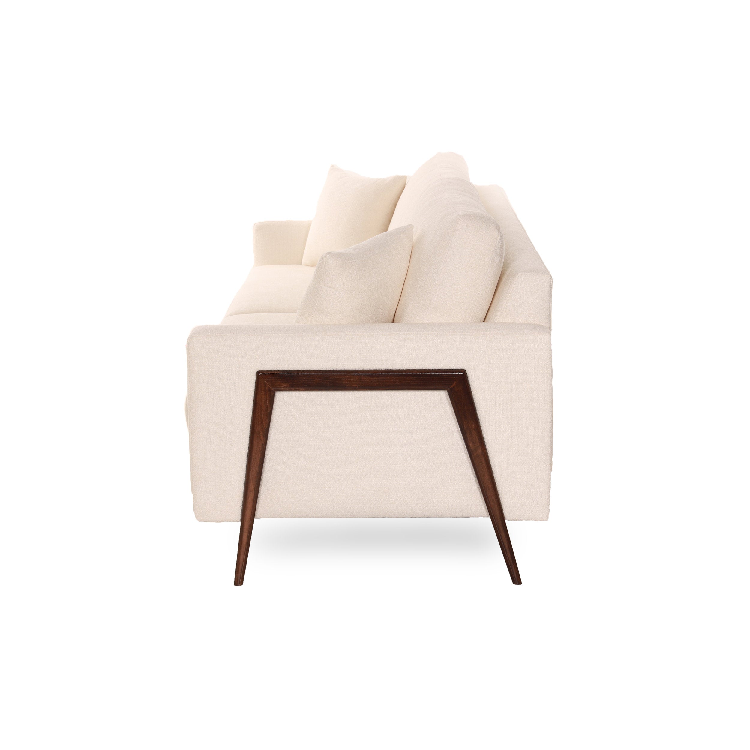 Beige Sofa sideview with wooden legs on a white background