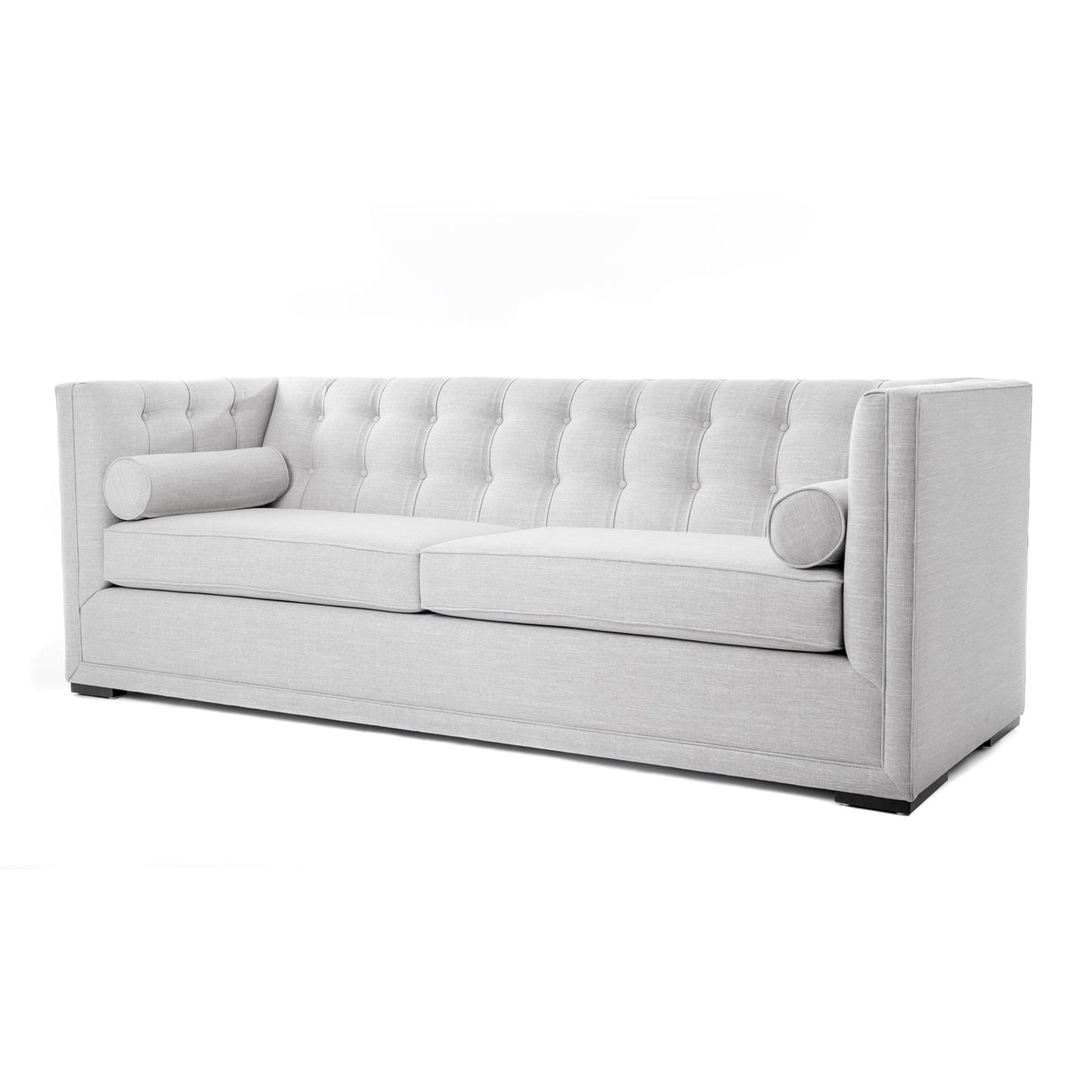 Gray tufted sofa on a white background