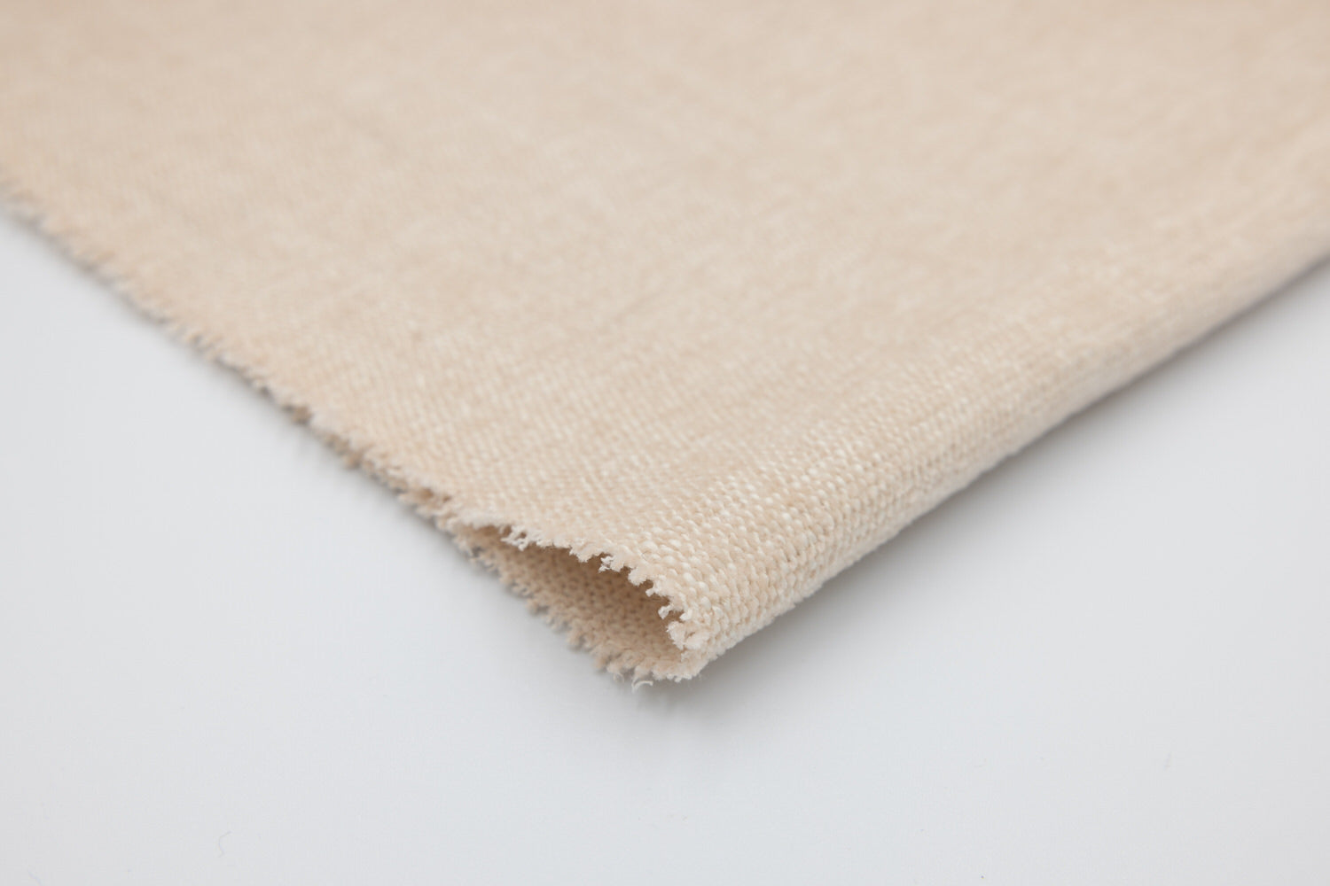 Sublime Bubblegum beige soft woven fabric swatch with natural linen texture and frayed edge; VanGogh Designs in muted tan.