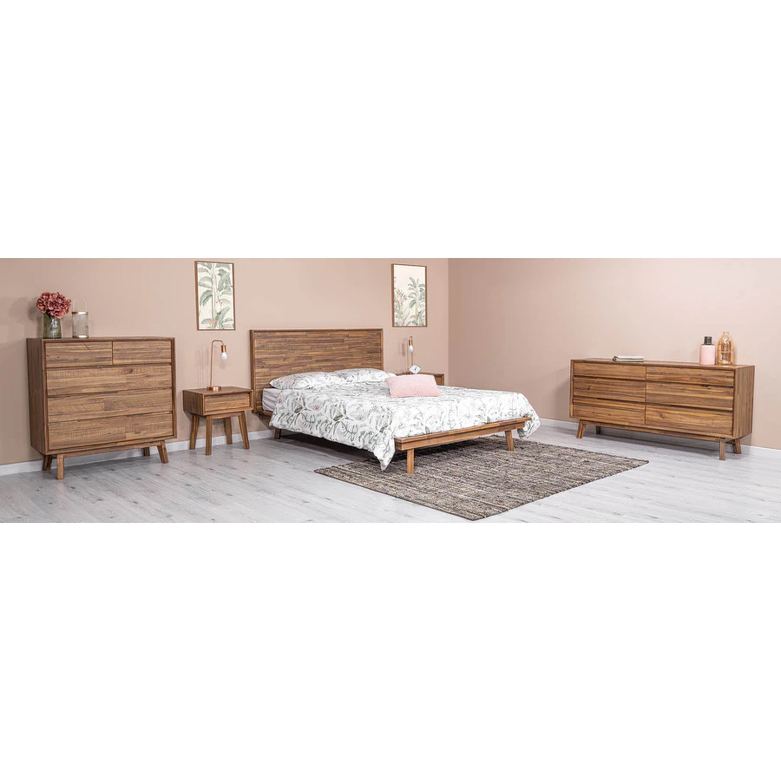 Wooden bedroom furniture set with bed, dressers, and nightstands in a room.