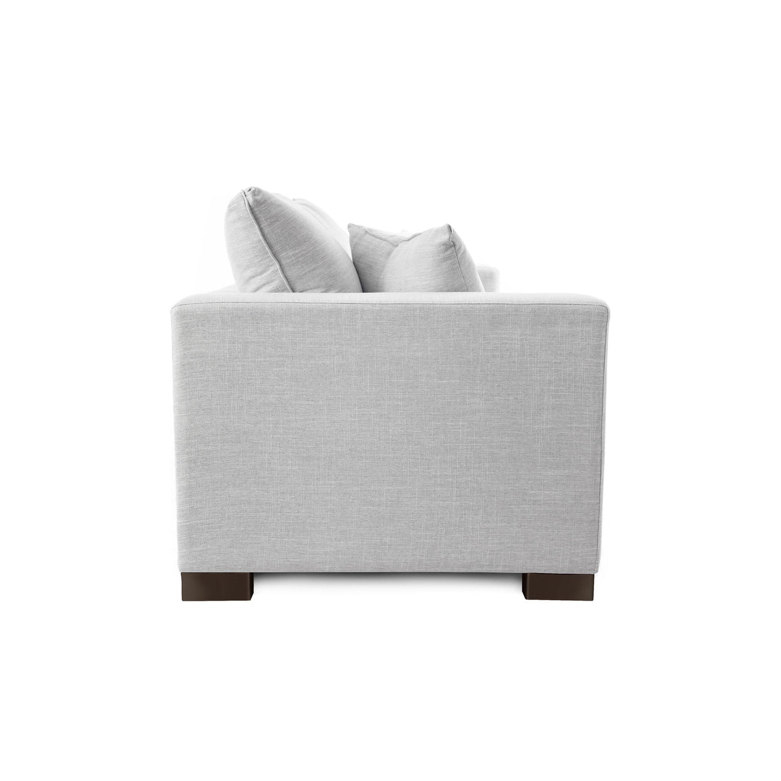 Gray upholstered chair with wooden legs on a white background