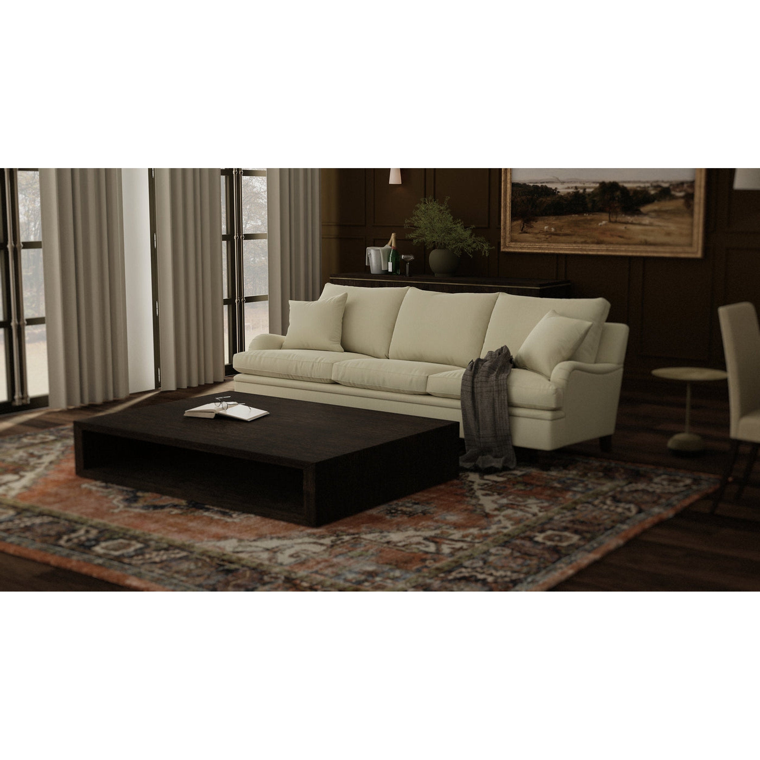 Beige sofa in a living room with a dark coffee table and decorative elements.