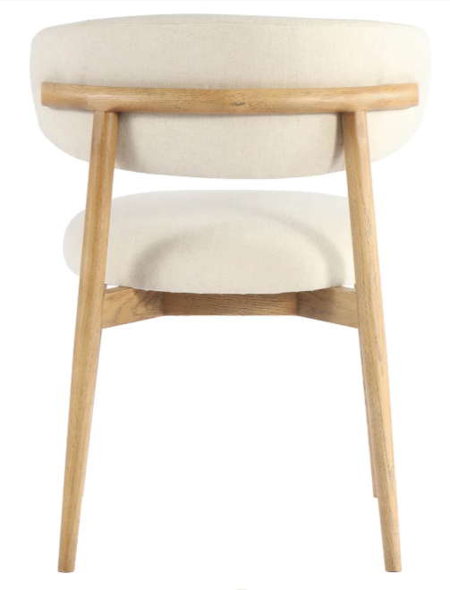 backview of a An off-white dining chair with a curved backrest and a solid ash wood frame.