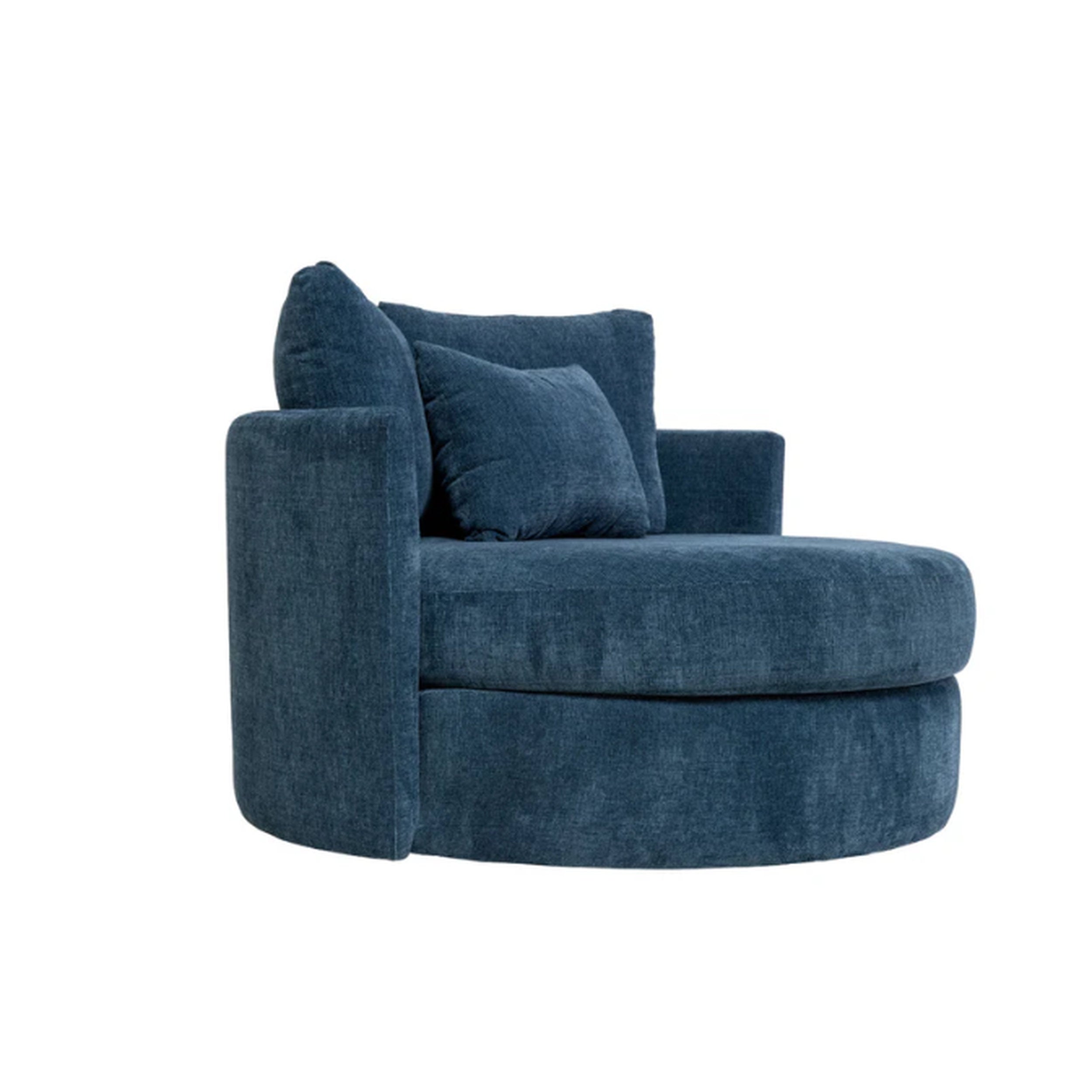 Blue armchair with cushions on a white background