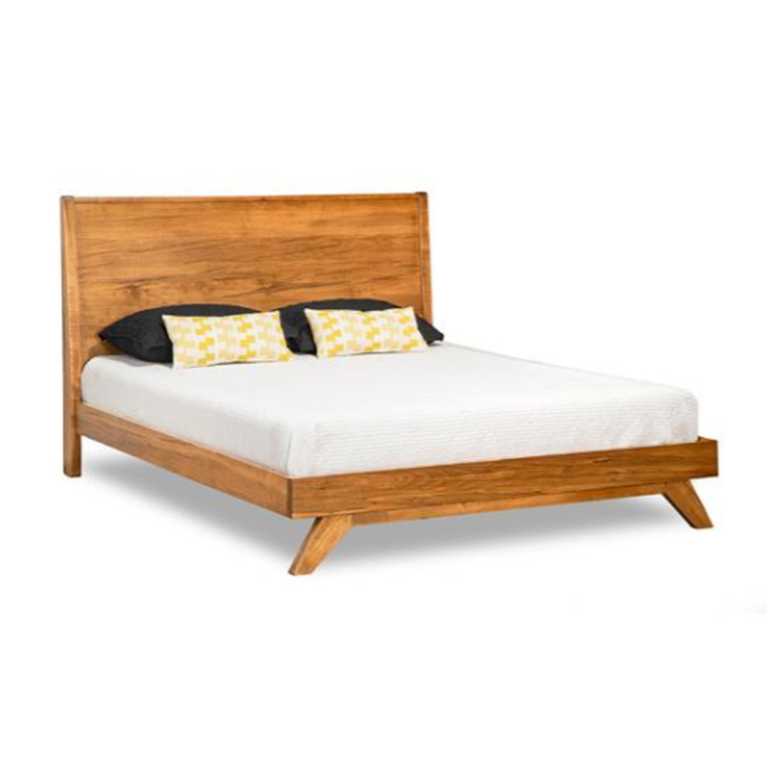 Wooden bed with white mattress and decorative pillows on a white background