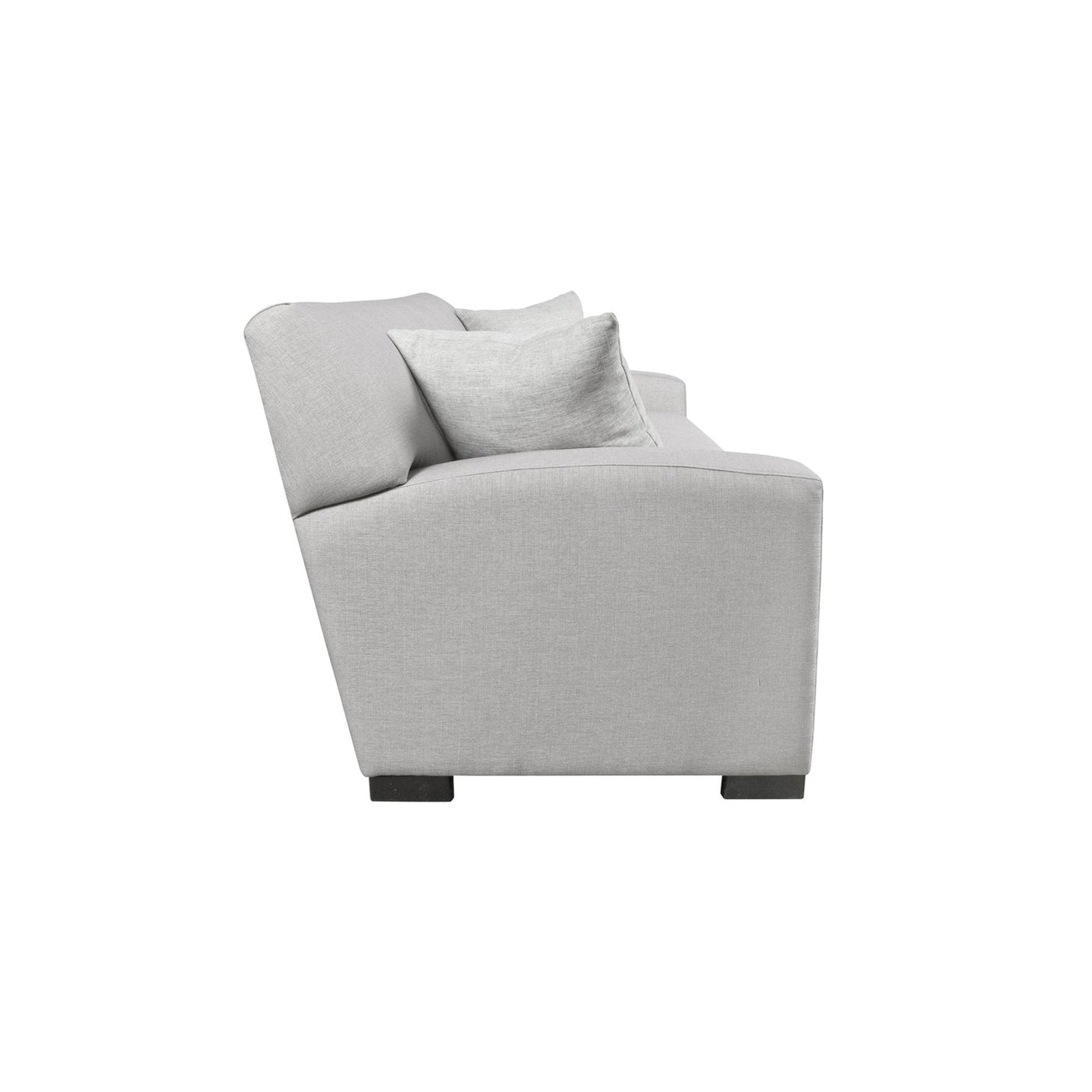 Gray sofa with cushions on a white background