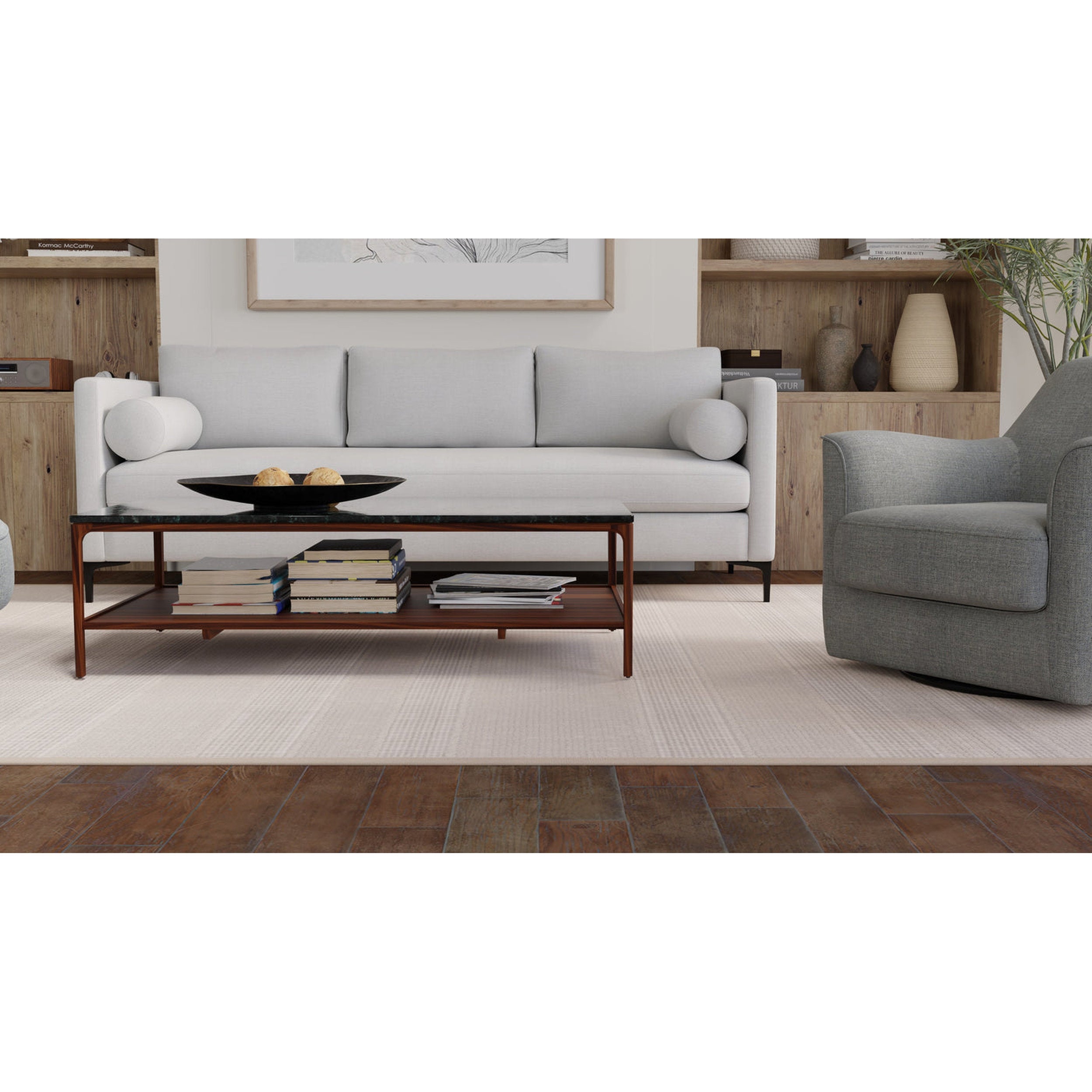 Modern living room with a gray sofa, armchair, and coffee table.