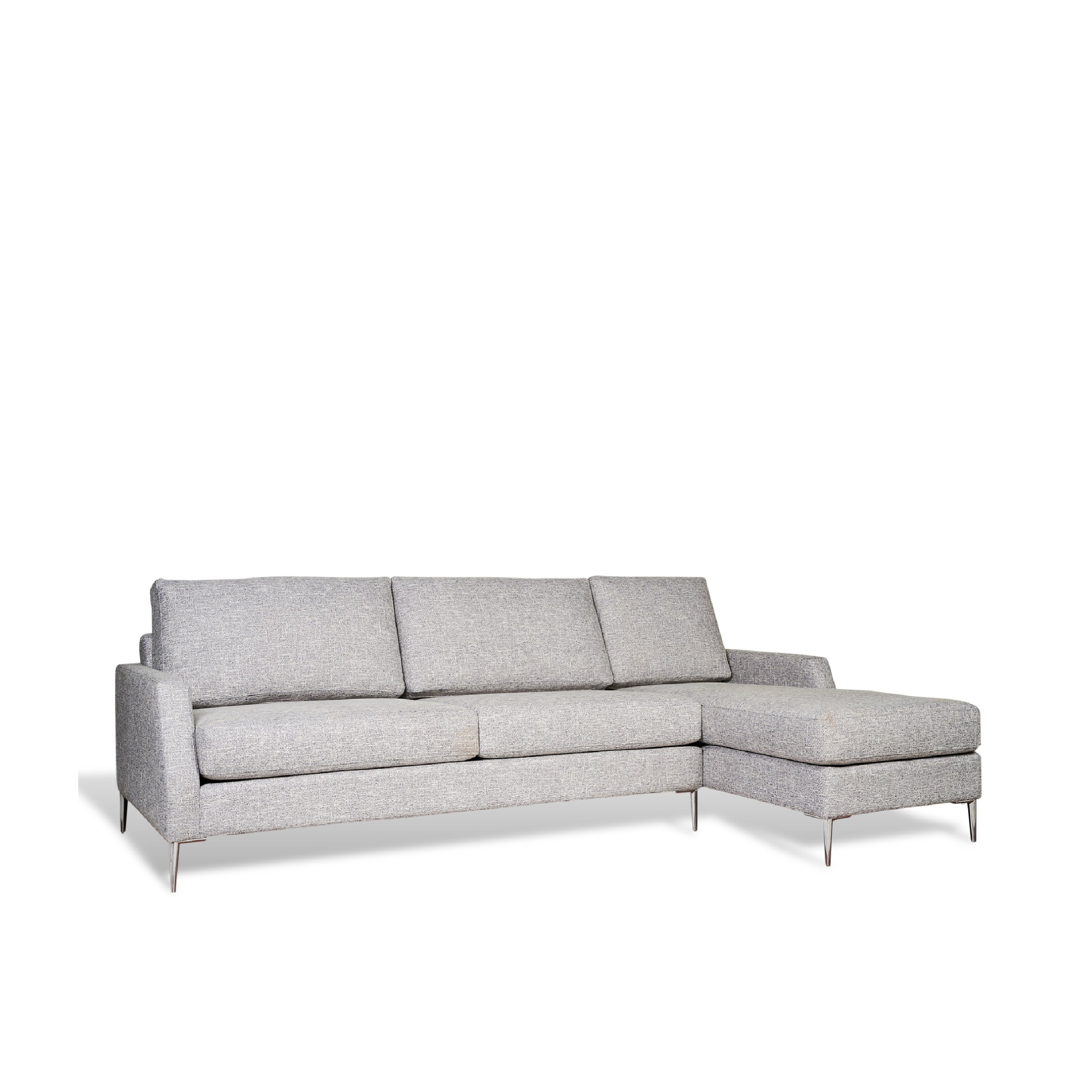 A gray upholstered sectional chaise