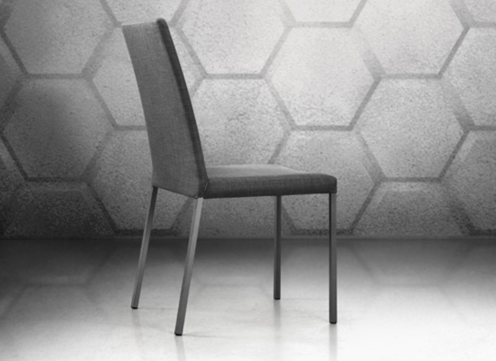 A black upholstered dining chair with a tubular steel frame and a high backrest.