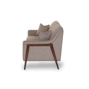 Side View Of a Beige sofa with wooden legs on a white background