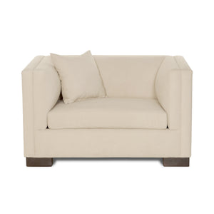 Beige armchair with a pillow on a white background