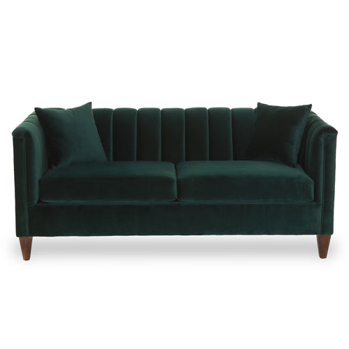 Green velvet sofa on a white background
