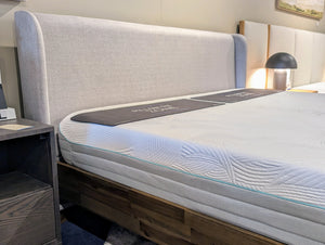 Bedgear Mattress on Aura Bedframe. Bedframe a dark wood and a fabric grey headboard