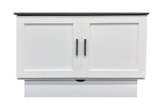 Load image into Gallery viewer, front facing White Cabinet Bed With black wood top. Shows two black handles and a drawer of storage underneath
