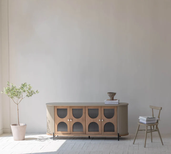colosseo sideboard on display in a beige room. 