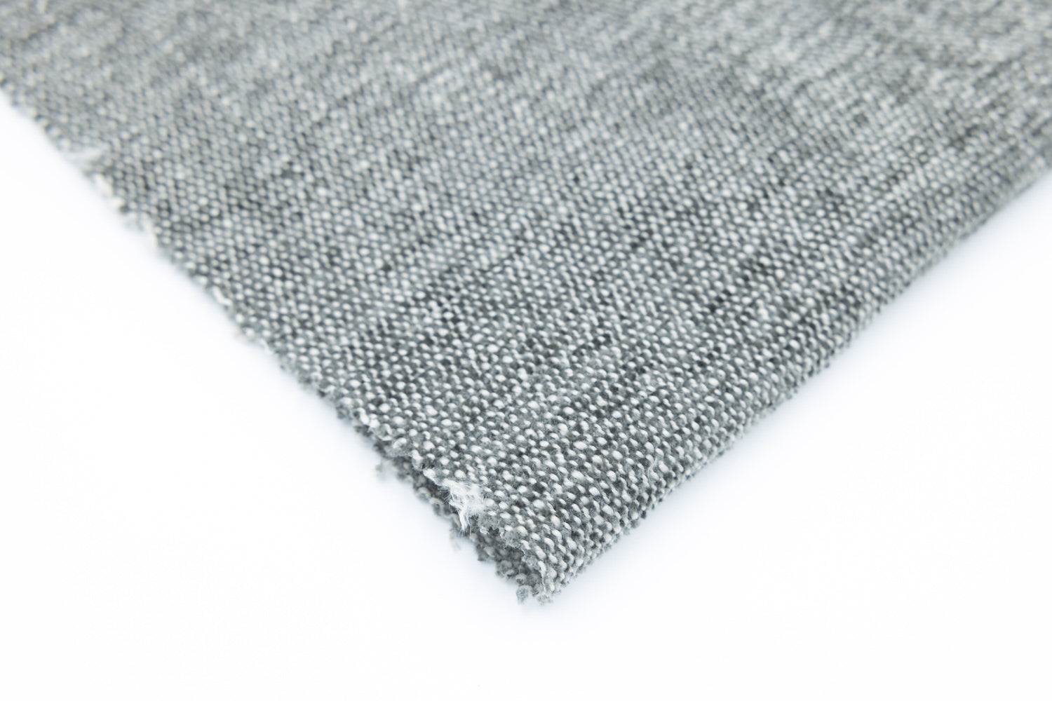 Sublime Carbon by Van Gogh Designs: charcoal gray woven fabric swatch with micro-dot texture, matte linen blend, frayed edge.