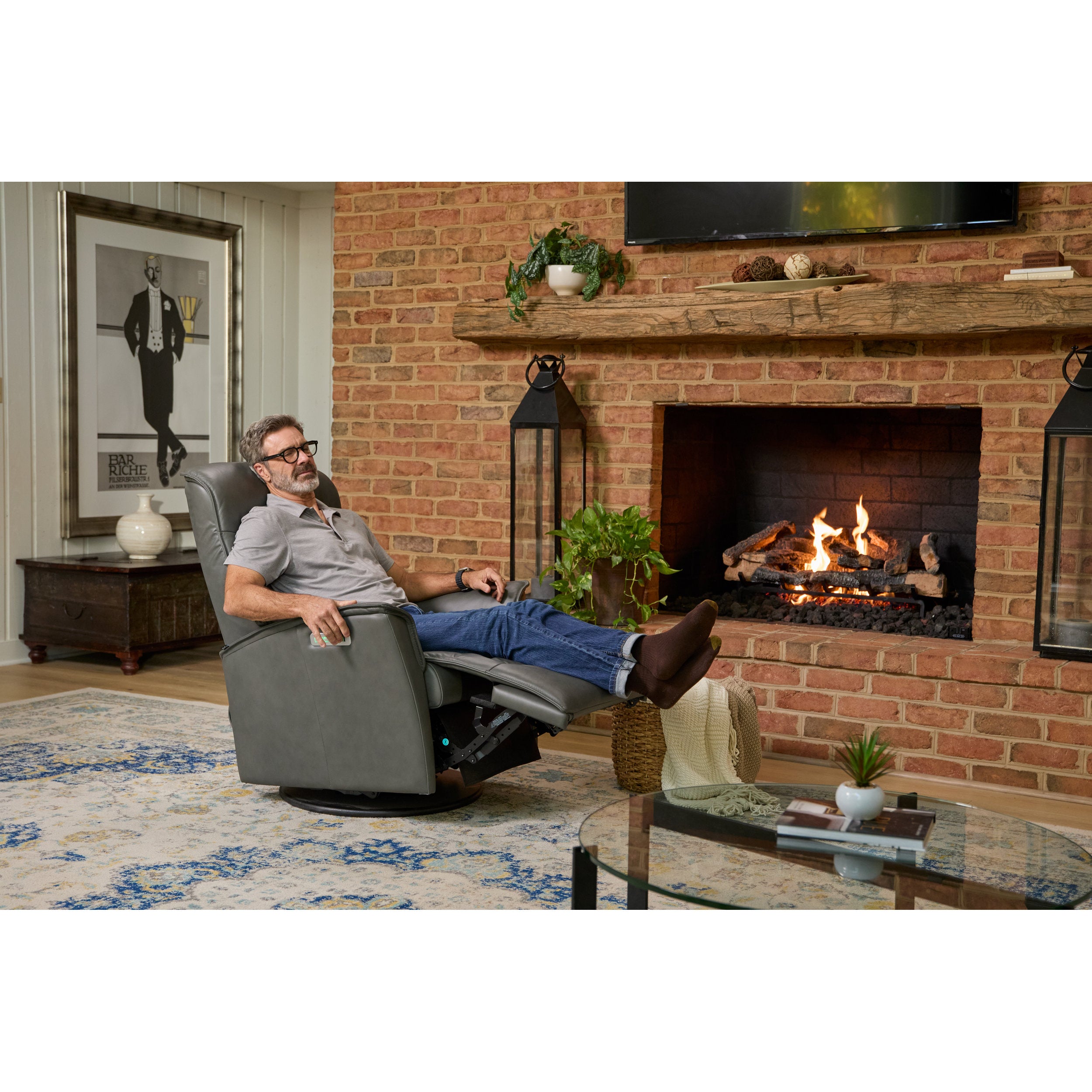 Man relaxing in a recliner chair in a cozy living room with a fireplace.