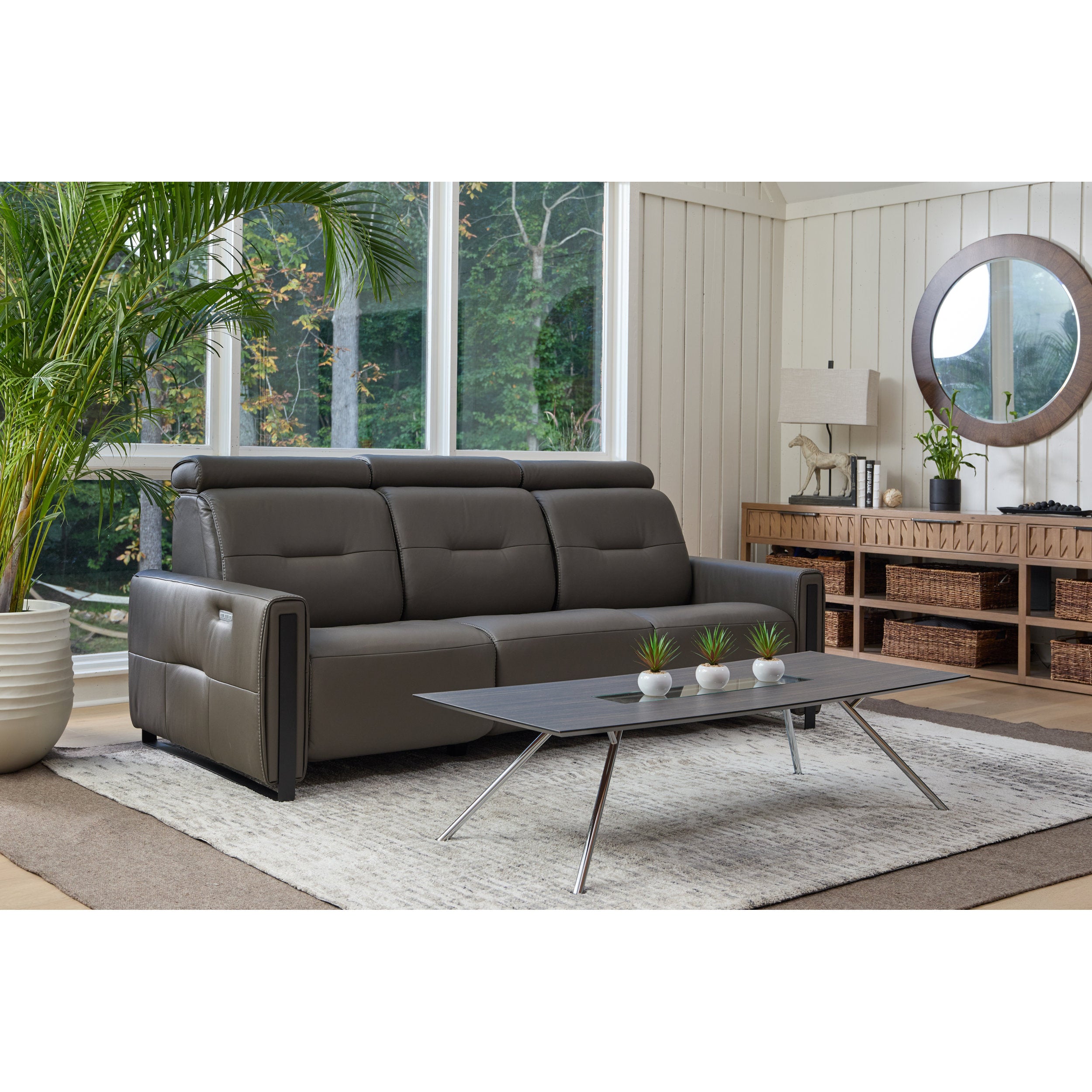 Gray sectional sofa in a living room with a coffee table and decorative items.
