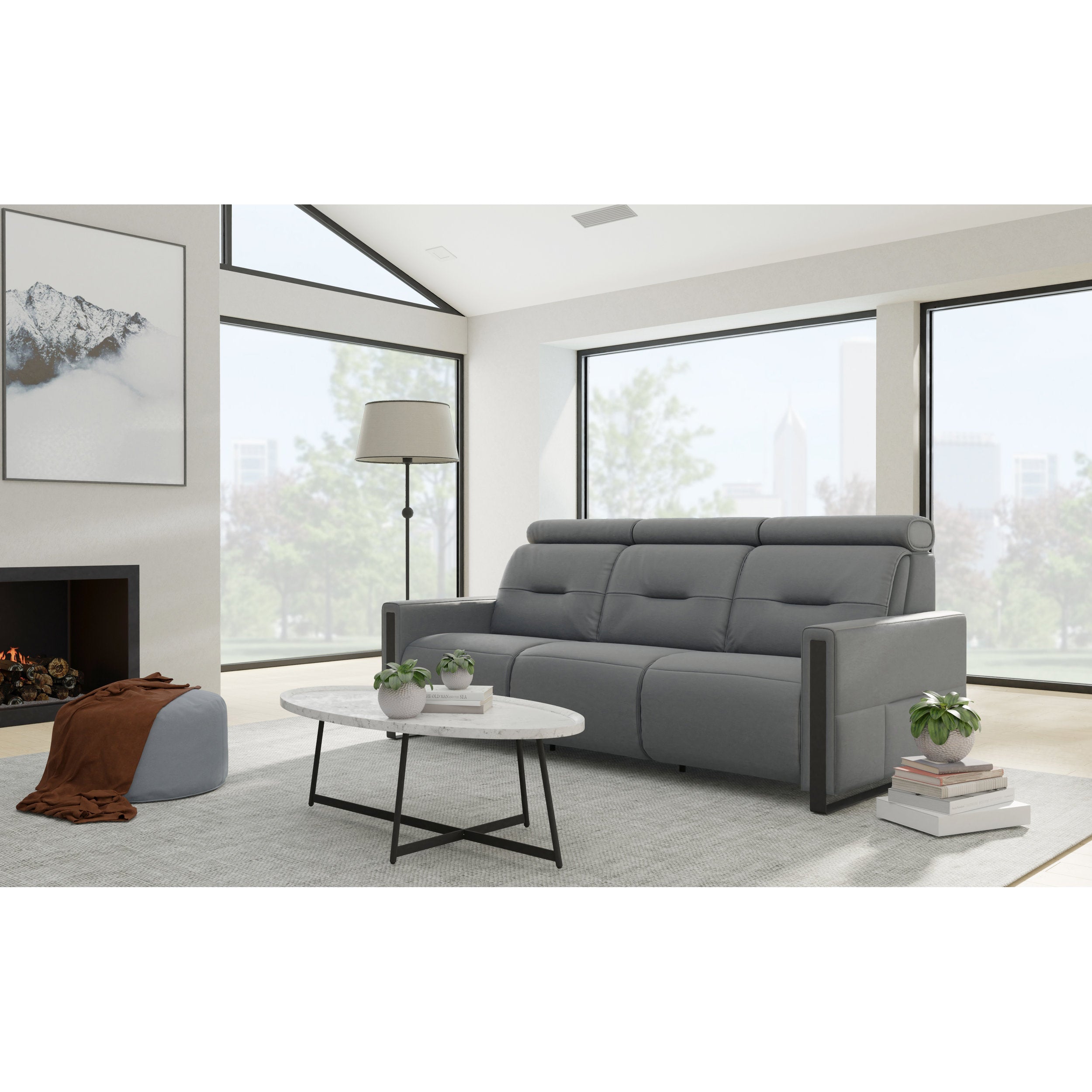 Gray sofa in a modern living room with large windows and a fireplace.
