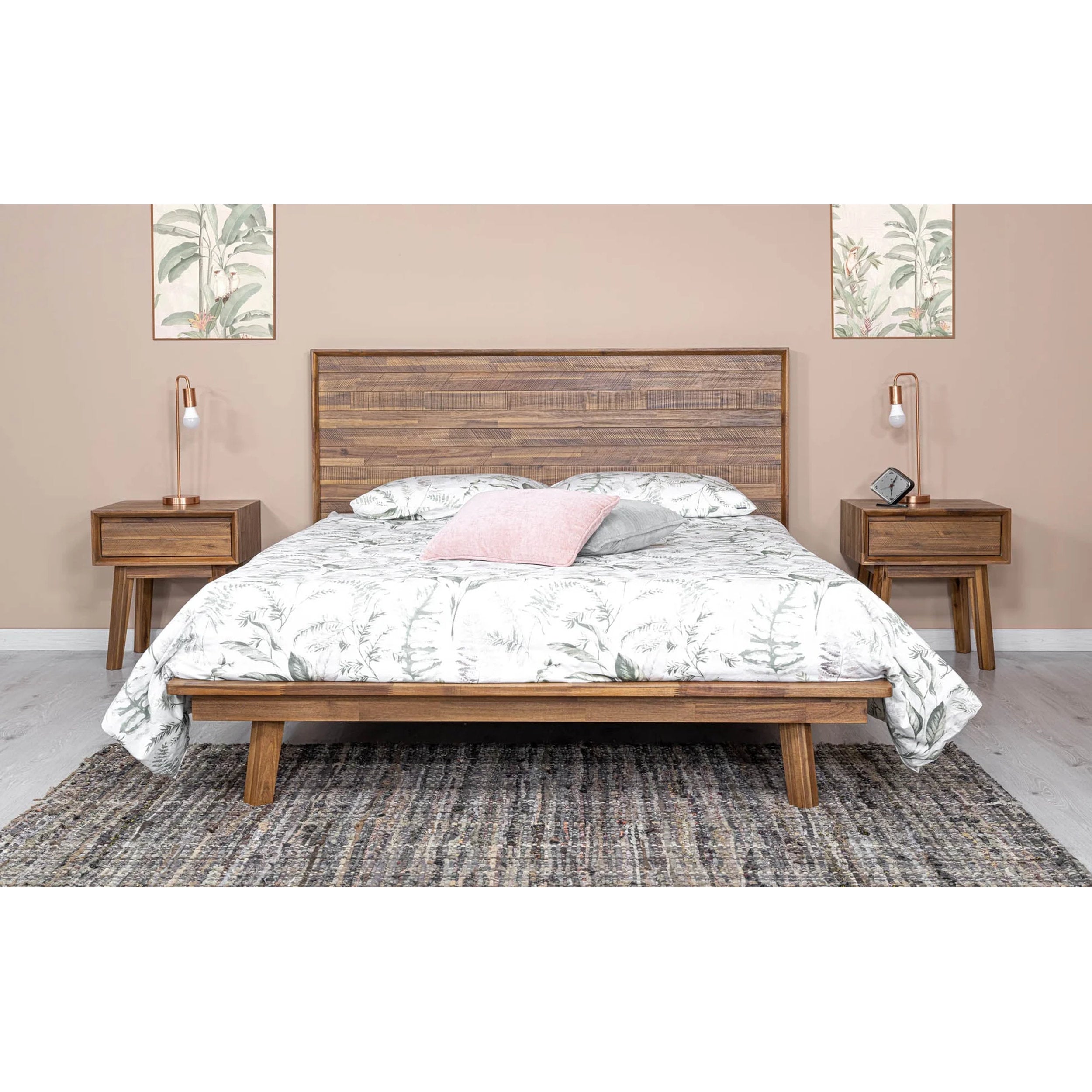 Wooden bed with bedding in a bedroom setting
