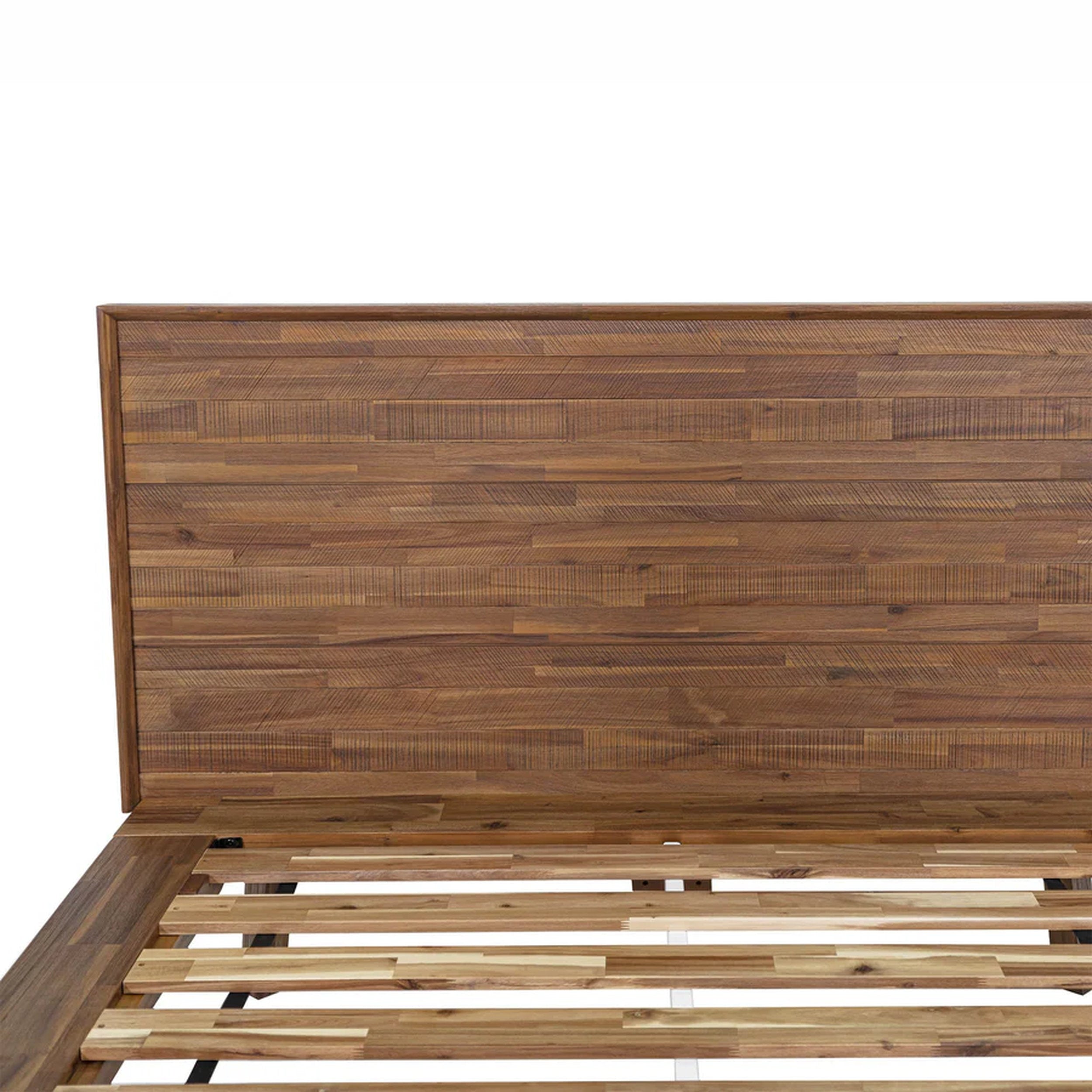 Wooden bed frame with a slatted design on a white background
