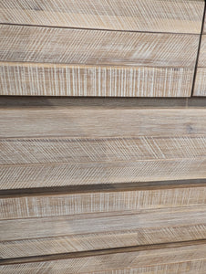 Close-up of wood dresser in a natural finish