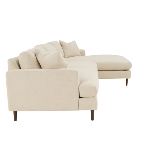 A beige right-sectional sofa sideview showing brown legs and a cream fabric