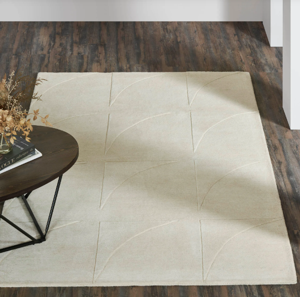 rug out on display on a wood flood