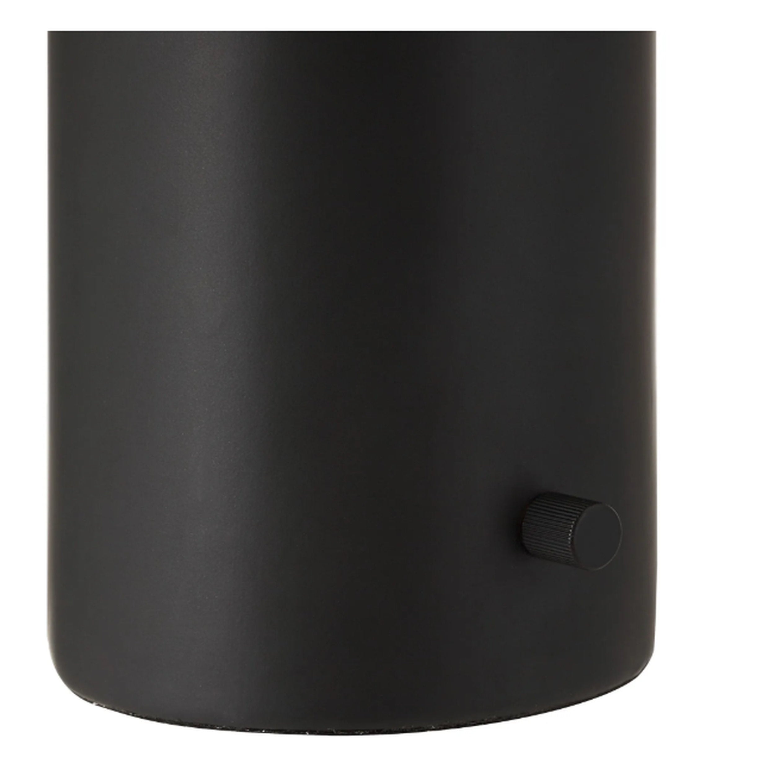 Black cylindrical object with a knob on a white background