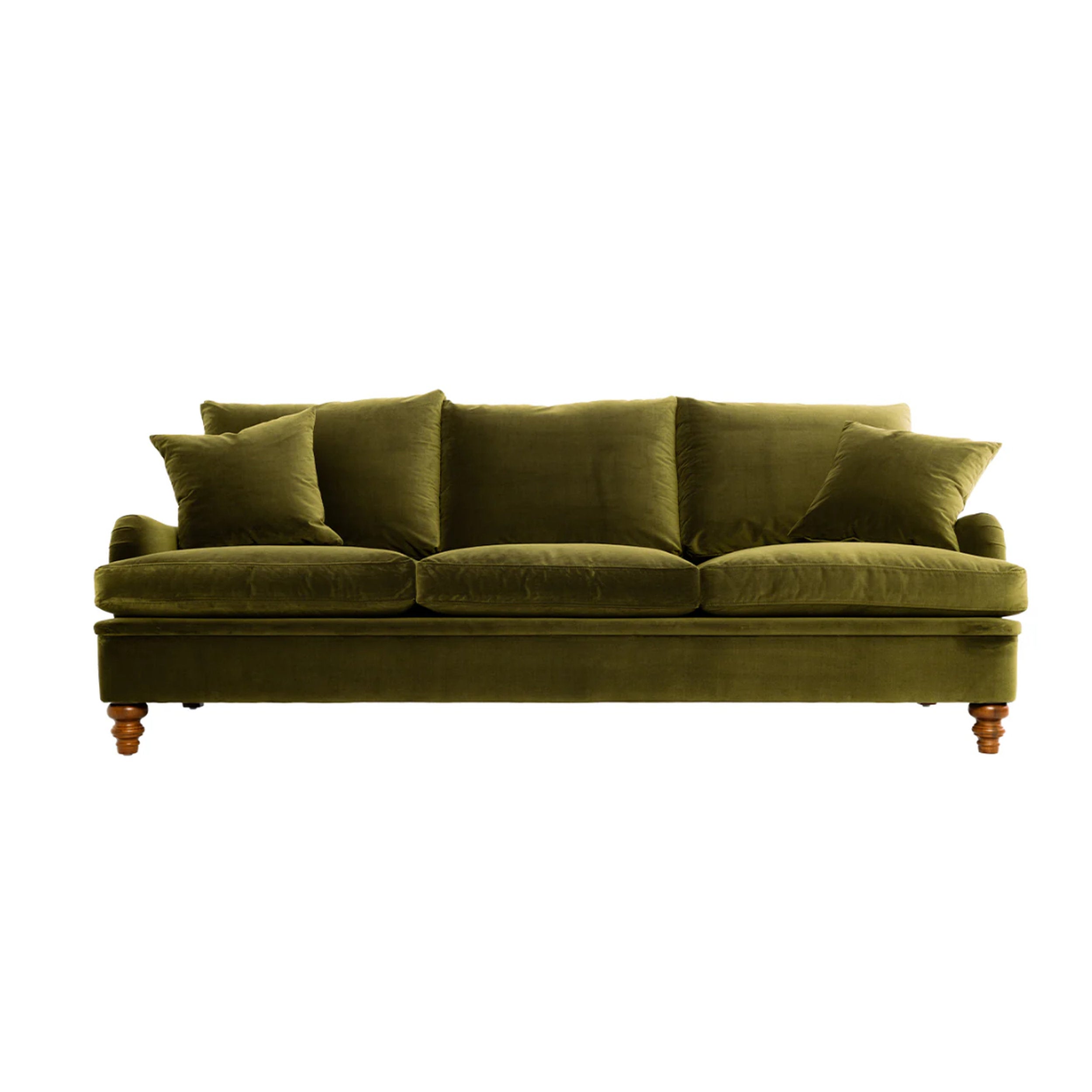 Green velvet sofa with cushions on a white background