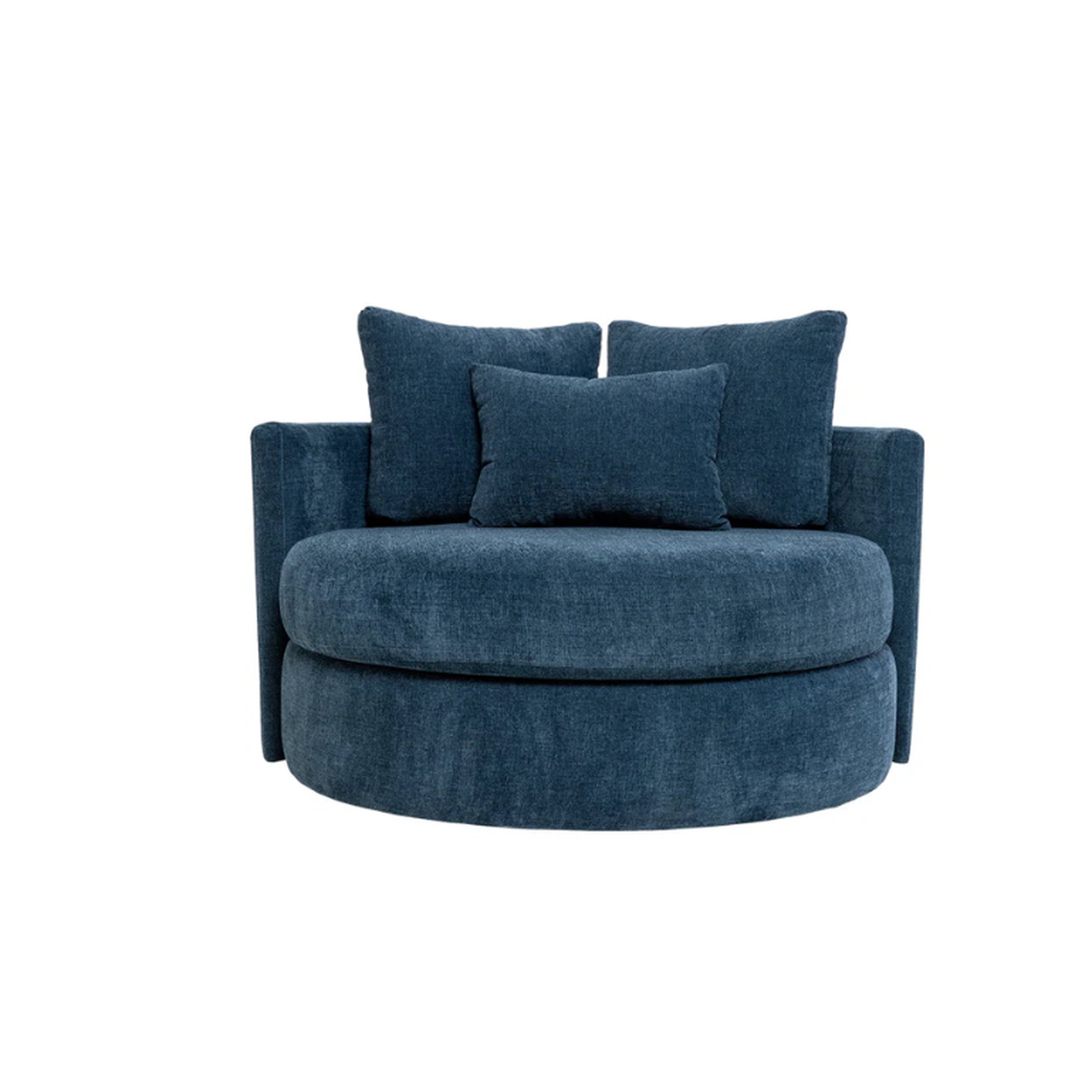 Blue swivel chair with cushions on a white background