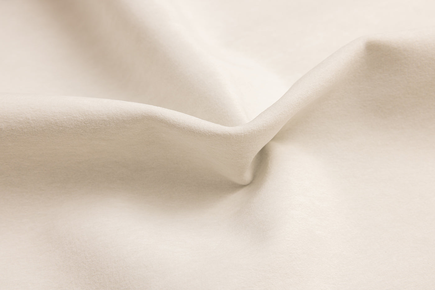 Stewart Shell by Van Gogh Designs in creamy ivory suede fabric with soft folds, smooth texture, and warm beige undertones