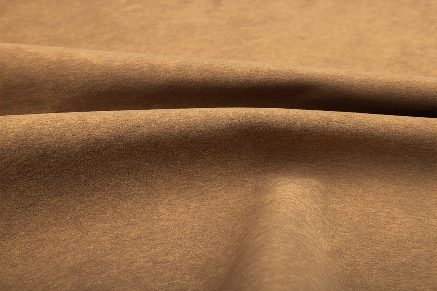 Stewart Toffee suede fabric swatch in warm golden brown, soft leather-like texture with folds; Van Gogh Designs branding.