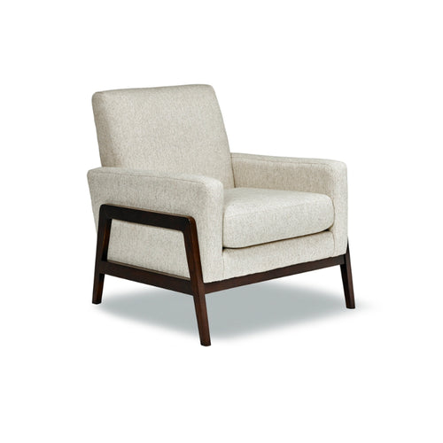 Beige armchair with wooden legs on a white background