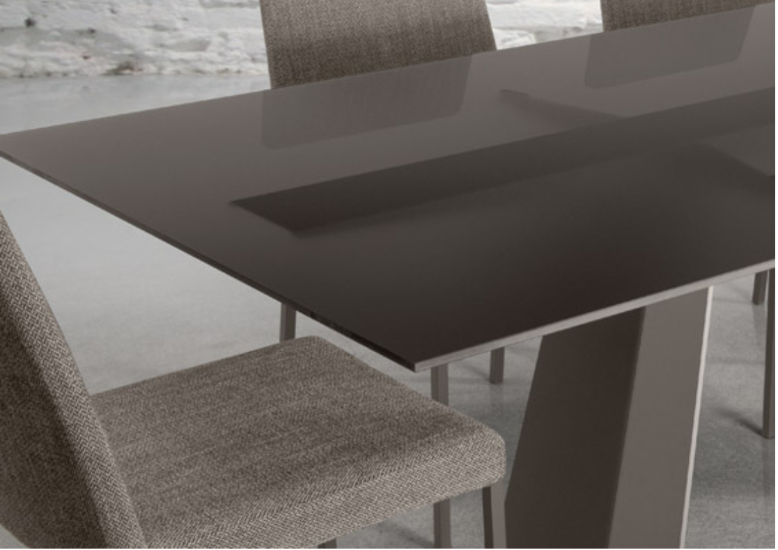 closeup of the pure table showing an etched brown glass top