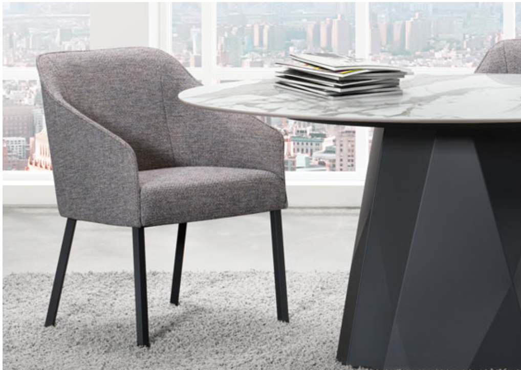 A modern gray fabric upholstered dining chair with a metal frame